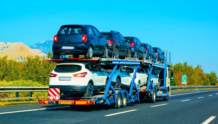 full car carrier driving on highway